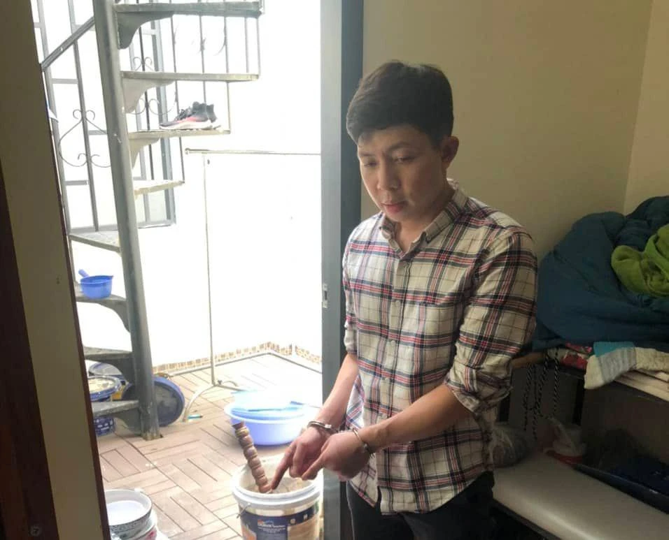 Việt khi bị công an bắt giữ. Ảnh: CA