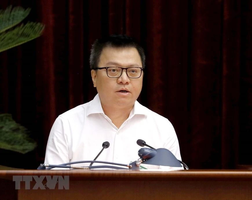 Ông Lê Quốc Minh, Uỷ viên Trung ương Đảng, Phó trưởng Ban Tuyên giáo Trung ương, Tổng Biên tập Báo Nhân Dân, Chủ tịch Hội Nhà báo Việt Nam tham luận tại hội nghị. Ảnh: TTXVN