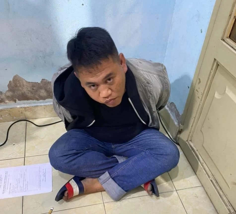 Trần Kim Thuận bị công an bắt giữ. Ảnh: NY