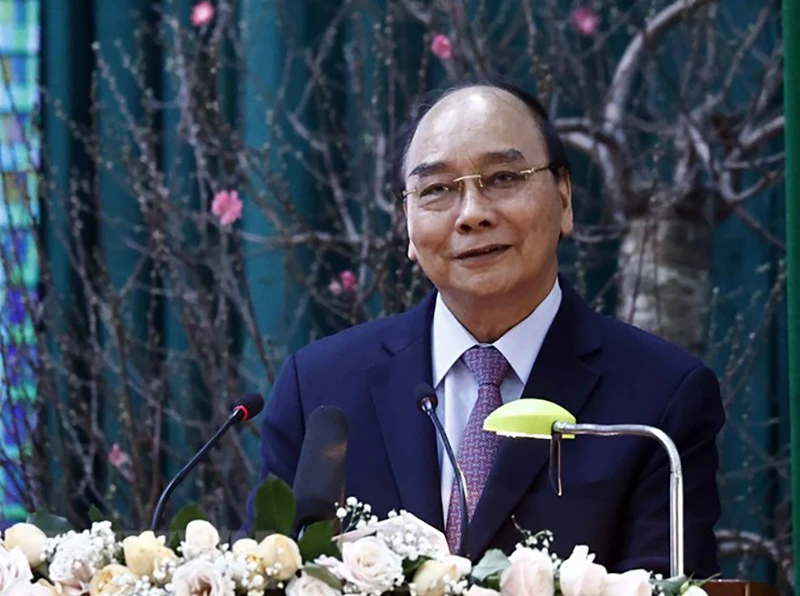 Chủ tịch nước Nguyễn Xuân Phúc chúc Tết cán bộ, chiến sỹ Bộ đội Biên phòng tỉnh Đắk Lắk. Ảnh: TTXVN