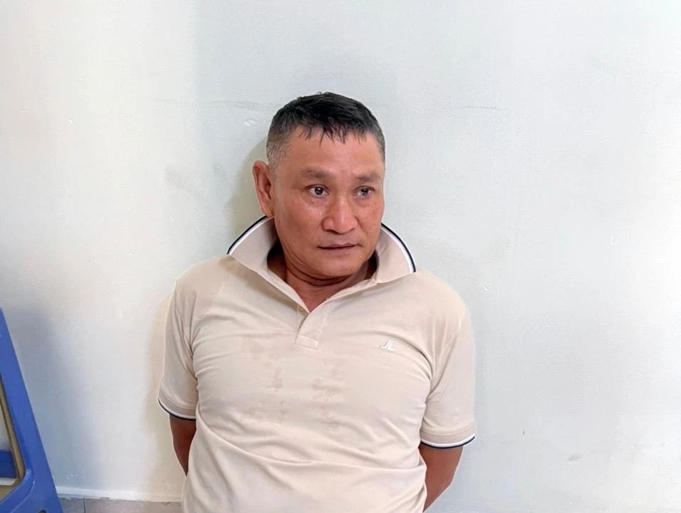 Đinh Viết Dũng lúc bị bắt giữ. Ảnh TS.