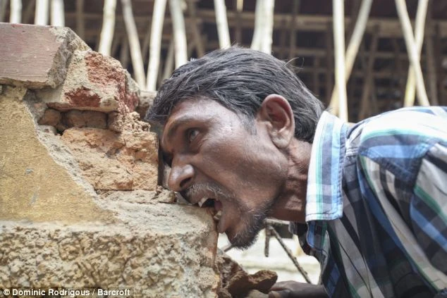 Addicted: Pakkirappa Hunagundi has been eating the brick, gravel and mud of Karnataka, India, for years