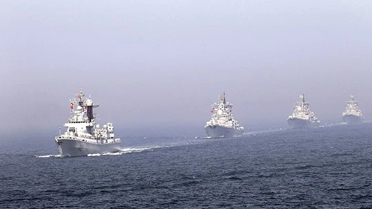 (FILE) Chinese missile destroyers navigate during the fleets review of the China-Russia joint naval exercise in the Yellow Sea April 26, 2012. (Reuters / China Daily)