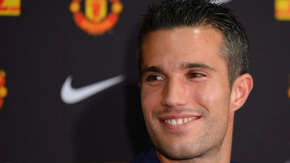 Van Persie rời Arsenal để gia nhập MU vào tháng 8-2012. ẢNH: GETTY