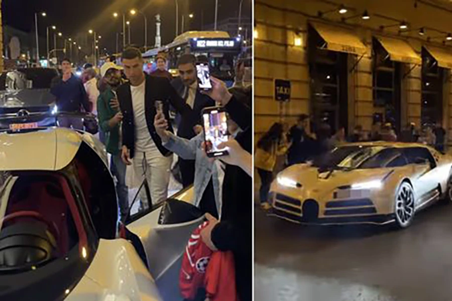 Fan Real Madrid chào đón Ronaldo rất nồng nhiệt khiến siêu xe Bugatti Centodiece của anh khó di chuyển vì bị bao vây. ẢNH: DAILY STAR