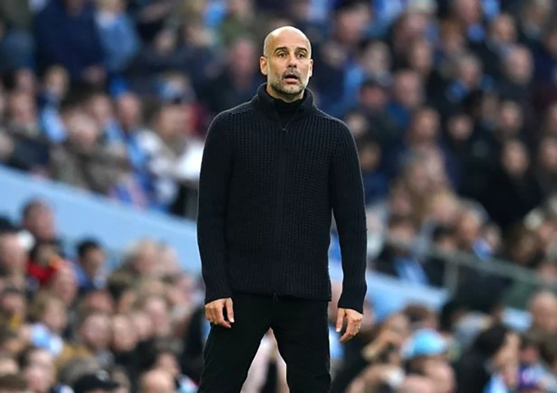 HLV Pep Guardiola đang giúp Man City tiến gần đến cú ăn ba lịch sử gồm vô địch Premier League, Champions League và FA Cup. ẢNH: GETTY