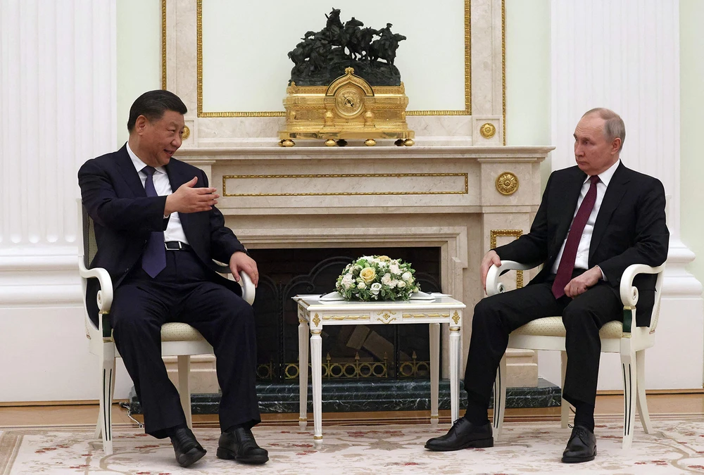 Tổng thống Nga Vladimir Putin (phải) gặp Chủ tịch Trung Quốc Tập Cận Bình tại Điện Kremlin, thủ đô Moscow (Nga) ngày 20 -3. Ảnh: SPUTNIK