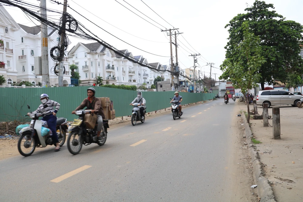 Dự án mở rộng đường Dương Quảng Hàm (quận Gò Vấp, TP.HCM) đạt tỉ lệ giải ngân vốn đầu tư công 56,08% và có 115 hộ đã bàn giao mặt bằng. Ảnh: NHƯ NGỌC