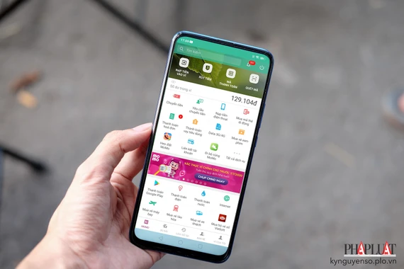 Đại diện MoMo cho biết thông tin ứng dụng bị hack là tin giả. Ảnh: TIỂU MINH vi-dien-tu-momo.jpg