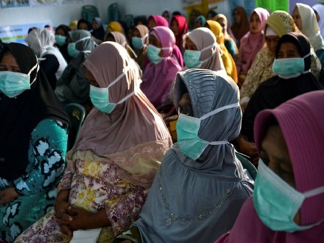 Một số người dân Indonesia cho rằng thông tin về COVID-19 không được cung cấp đầy đủ, Ảnh: AFP