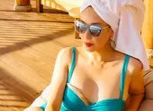 Hà Kiều Anh xin lỗi về chia sẻ ‘công chúa đời thứ 7 triều Nguyễn’ ảnh 5 Hoa hậu Hà Kiều Anh khoe dáng gợi cảm trước biển
