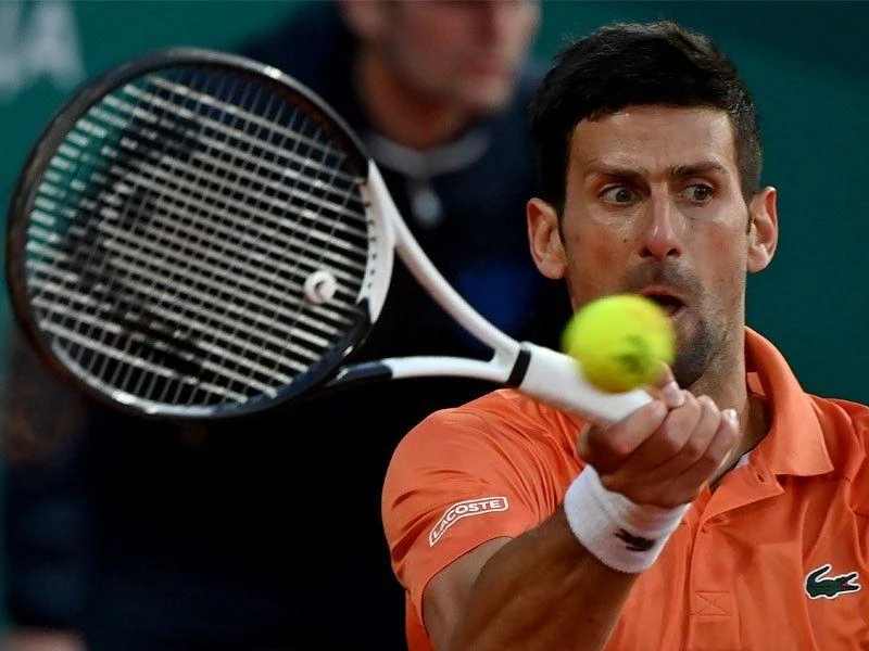 Djokovic dùng từ "điên rồ" để nói về Anh cấm các tay vợt Nga dự Wimbledon. Ảnh: Getty