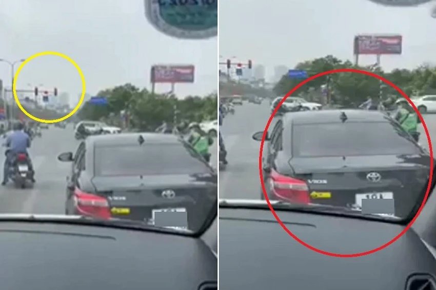 Chiếc xe ô tô đang dừng đèn đỏ, cương quyết không nhường đường cho xe cứu thương. Ảnh cắt từ clip Chiếc xe ô tô đang dừng đèn đỏ, cương quyết không nhường đường cho xe cứu thương. Ảnh cắt từ clip