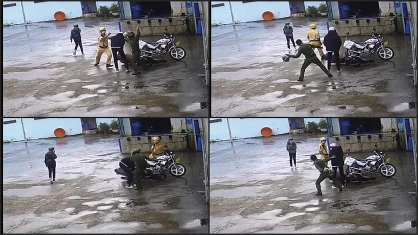 Hai người trong trang phục cảnh sát đã tấn công nam thanh niên với những "ngón đòn" gần như chí mạng. Ảnh cắt từ video. Hai người trong trang phục cảnh sát đã tấn công nam thanh niên với những "ngón đòn" gần như chí mạng. Ảnh cắt từ video.