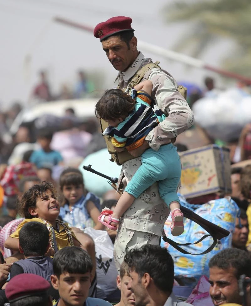 Ảnh: Người dân IRaq lũ lượt chạy trốn IS ảnh 4 Ảnh: Người dân IRaq lũ lượt chạy trốn IS ảnh 4