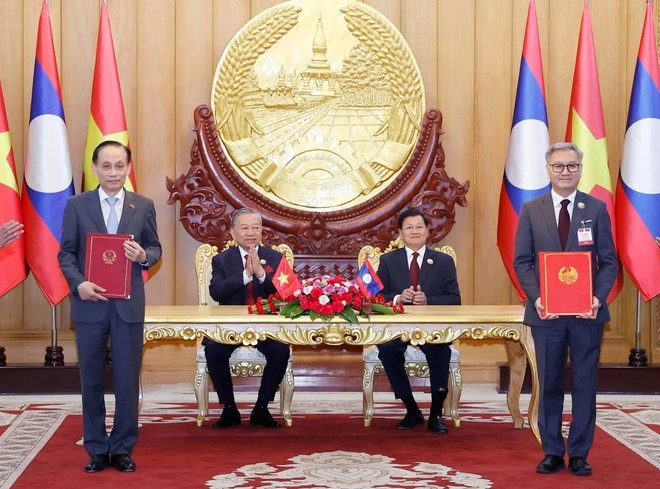 chuyen-tham-cua-tong-bi-thu-mo-ra-mot-chuong-moi-nang-tam-quan-he-viet-lao-1.jpg