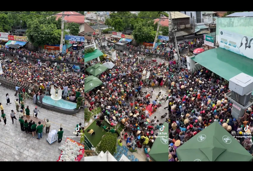Hàng trăm người tập trung trước cổng một doanh nghiệp trên đường An Dương Vương, phường 13, quận 6 rồi phá cổng lao vào bên trong để nhận quà. Ảnh cắt từ clip