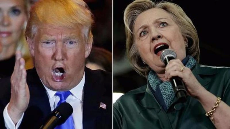 Bà Clinton (phải) quyết không để ông Trump thành tổng thống. 