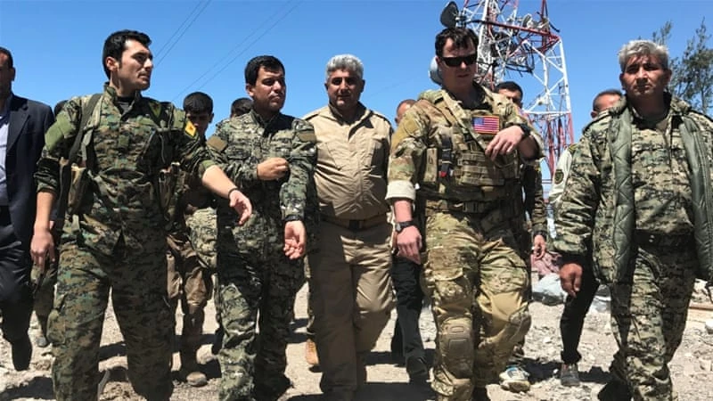 Lính Mỹ và một số tay súng người Kurd ở Syria trong một đợt huấn luyện. Ảnh: REUTERS