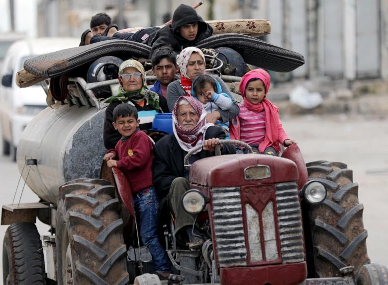 Dân thường Afrin sơ tán. Ảnh: REUTERS