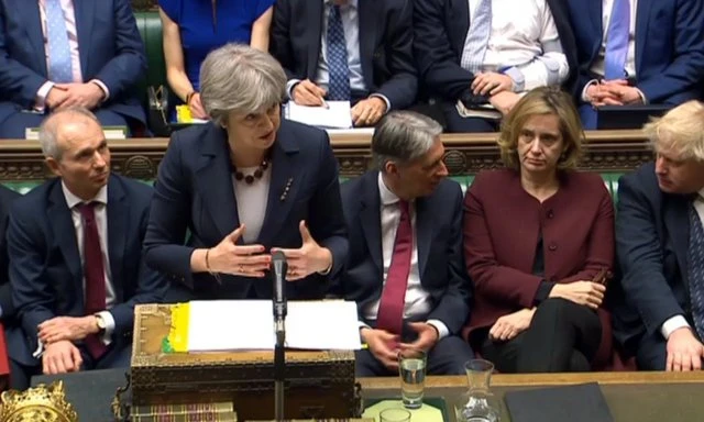 Thủ tướng Anh Theresa May phát biểu trước Hạ viện Anh ngày 14-3, thông báo trục xuất 23 nhà ngoại giao Nga. Ảnh AP