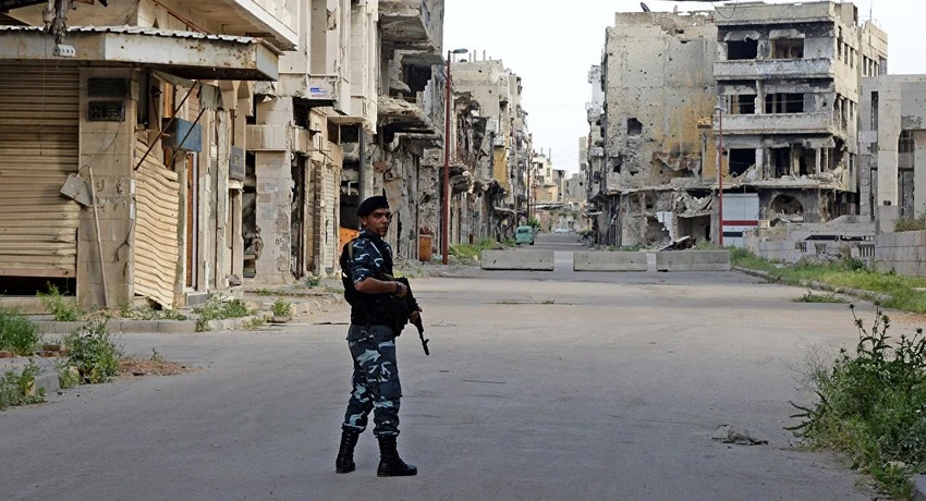Cảnh sát Syria tuần tra trên đường phố Homs. Ảnh: SPUTNIK