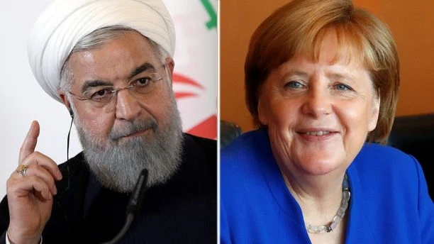Vì áp lực từ Mỹ, chính phủ Thủ tướng Đức Angela Merkel (phải) ra tay phong tỏa khoản 400 triệu đô Mỹ chuyển về cho chính phủ Tổng thống Iran Hassan Rouhani (trái). Ảnh: REUTERS