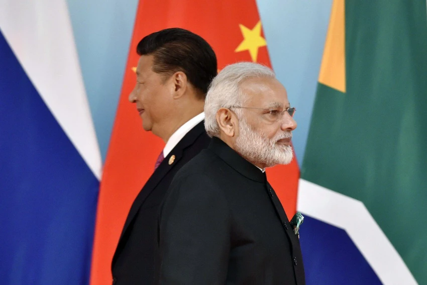 Chủ tịch Trung Quốc Tập Cận Bình (trái) và Thủ tướng Ấn Độ Narenda Modi dự kiến sẽ bàn các vấn đề biên giới, du lịch và thương mại trong lần gặp sắp tới. Ảnh: AFP