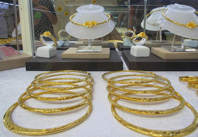 Phản ứng của giá vàng trong nước trước diễn biến của giá vàng thế giới trong những ngày qua khá chậm chạp - Ảnh A.H. Phản ứng của giá vàng trong nước trước diễn biến của giá vàng thế giới trong những ngày qua khá chậm chạp - Ảnh A.H.