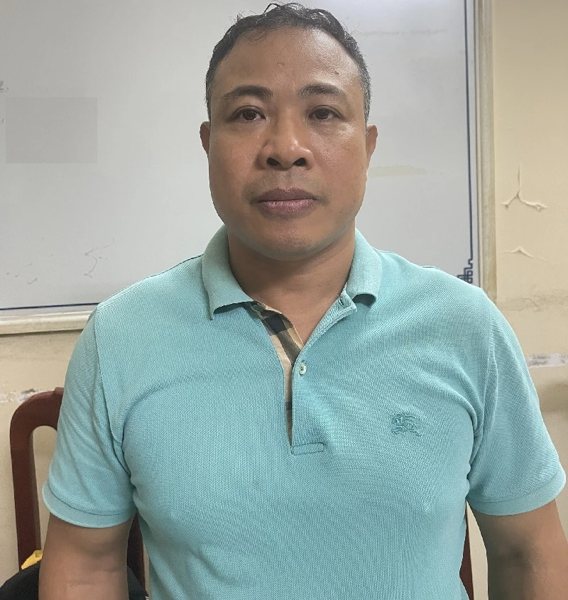Bị can Nghiêm Quang Minh. Ẩnh CA Bị can Nghiêm Quang Minh. Ẩnh CA