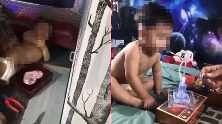 Hình ảnh bé trai nghi bị ép dùng ma túy đá khiến nhiều người bàng hoàng. Ảnh: Cắt từ clip Hình ảnh bé trai nghi bị ép dùng ma túy đá khiến nhiều người bàng hoàng. Ảnh: Cắt từ clip