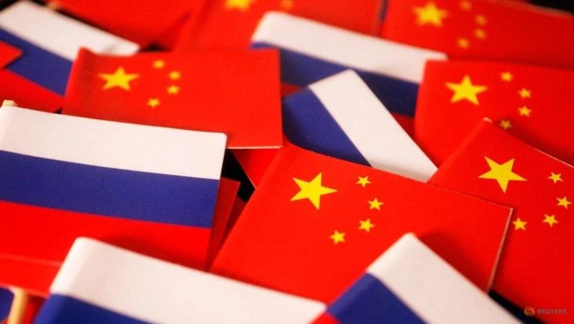 Quốc kỳ Nga và quốc kỳ Trung Quốc. Ảnh: REUTERS Quốc kỳ Nga và quốc kỳ Trung Quốc. Ảnh: REUTERS
