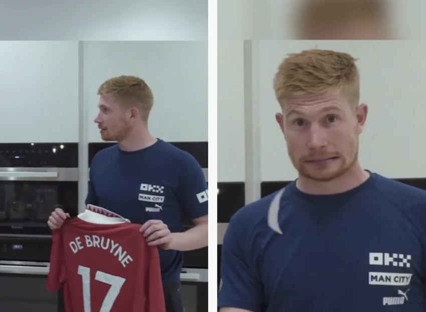 Biểu cảm ngộ nghĩnh của De Bruyne khi cầm chiếc áo của MU mang tên mình và đòi đốt nó. ẢNH: MIRROR Biểu cảm ngộ nghĩnh của De Bruyne khi cầm chiếc áo của MU mang tên mình và đòi đốt nó. ẢNH: MIRROR