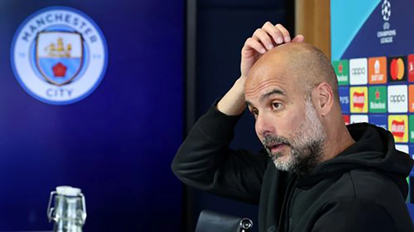 Pep Guardiola kêu gọi fan Man City quên đi mâu thuẫn với UEFA. ẢNH: GETTY